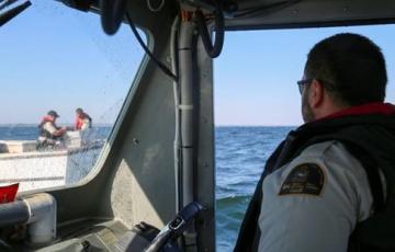 Fishery officer aboard a vessel 